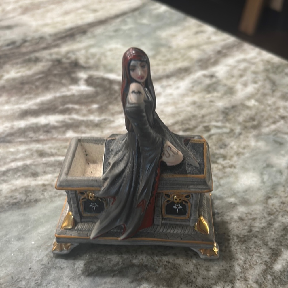 Gothic Figurine with Gold Accents